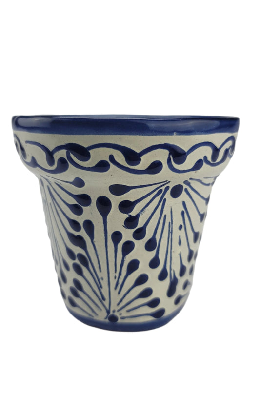 Ceramic wall hanging with blue floral pattern on a white background