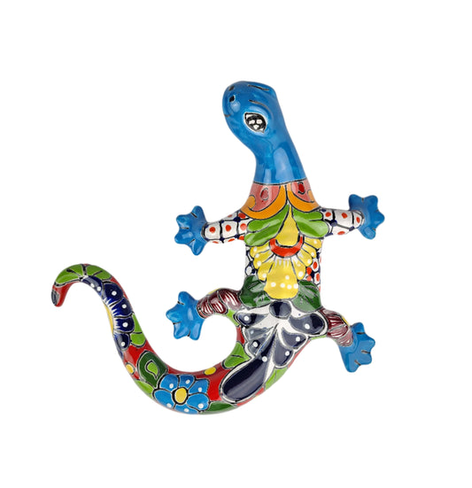 Colorful ceramic lizard wall art on a white background