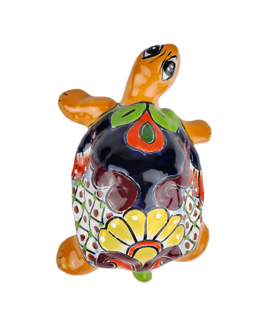 Colorful ceramic turtle figurine on a white background