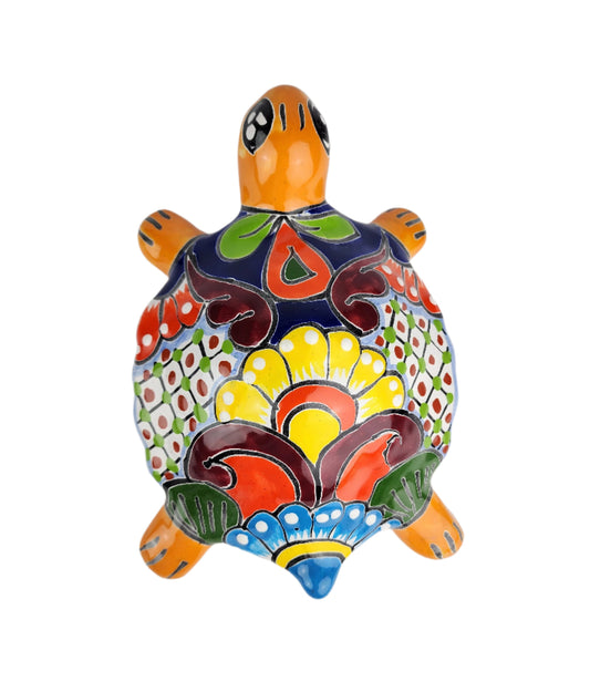 Colorful turtle-shaped ceramic figurine on a white background
