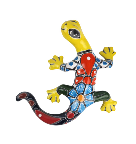 Colorful ceramic lizard on a white background