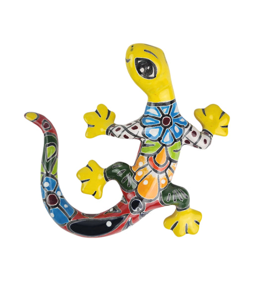 Colorful ceramic lizard figurine on a white background