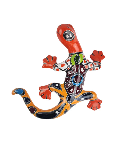 Colorful ceramic lizard sculpture on a white background