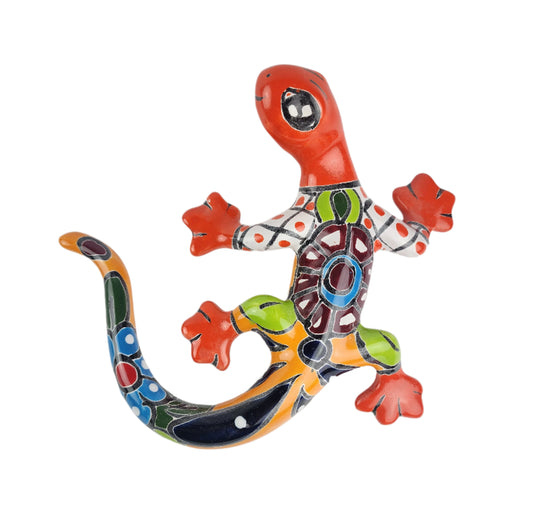 Colorful ceramic lizard wall art on a white background