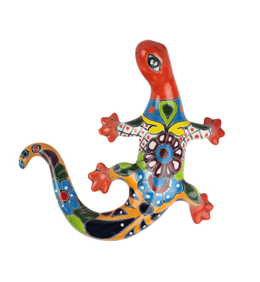 Colorful ceramic lizard wall art on a white background