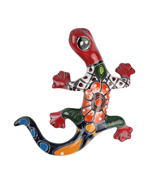 Colorful ceramic lizard wall art on a white background