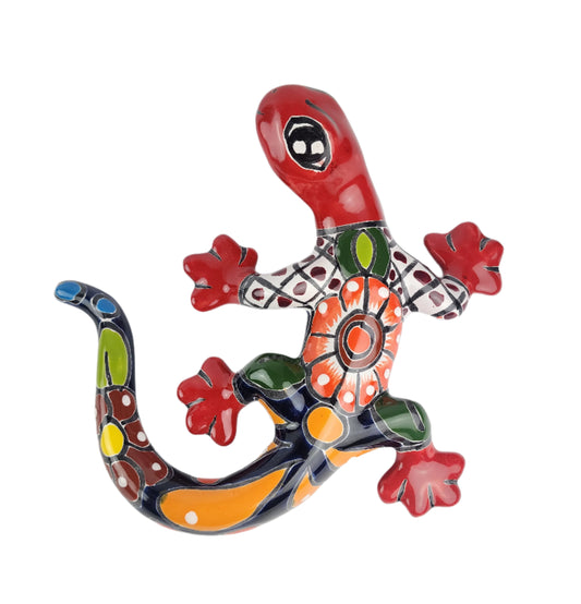 Colorful ceramic lizard wall art on a white background