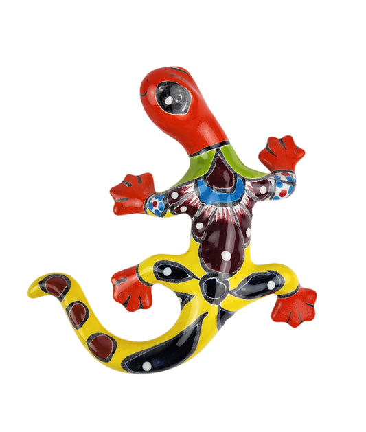 Colorful ceramic lizard wall art on a white background