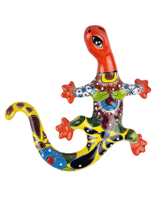 Colorful ceramic lizard wall art on a white background