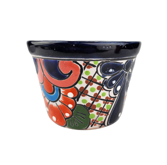 Decorative ceramic planter with colorful patterns on a white background