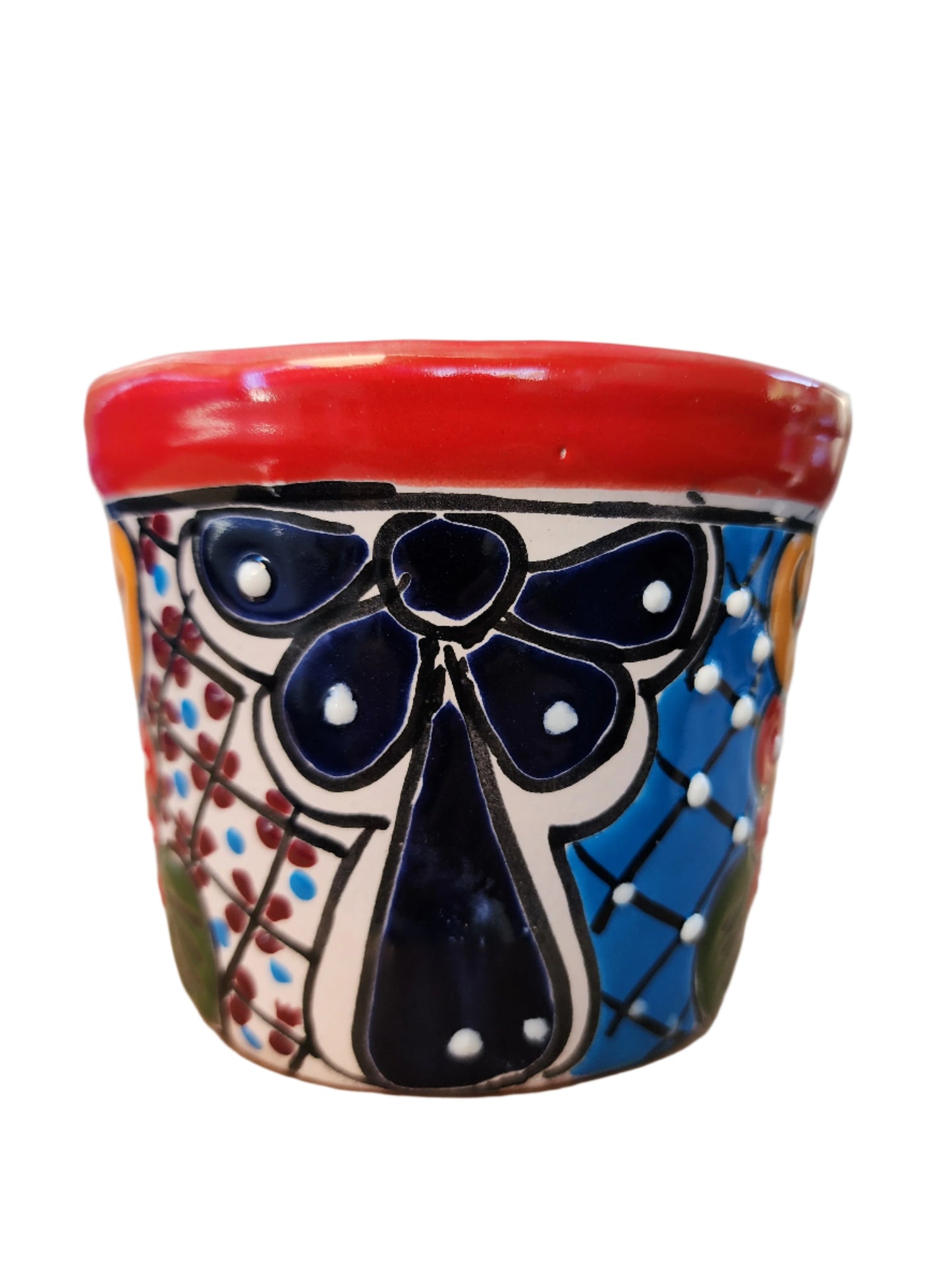 Decorative ceramic planter with floral design on a white background