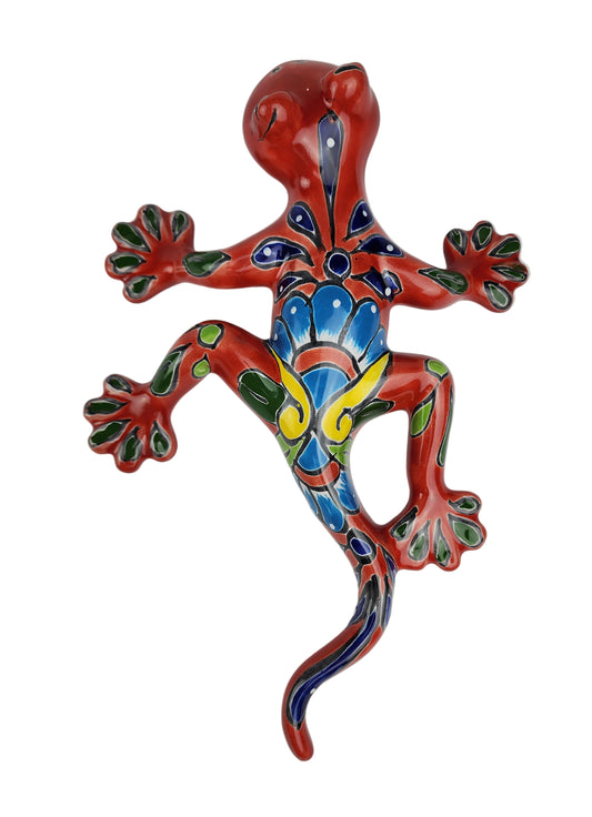 Colorful ceramic lizard on a white background