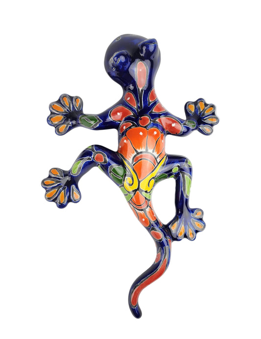 Blue salamander lizard on a white wall