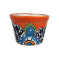 Red orange rim ceramic planter with sky blue and deep blue floral patterns, green leaf accents, white highlights, and black outlining on a white background.
