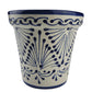 Ceramic cup with blue floral pattern on a white background