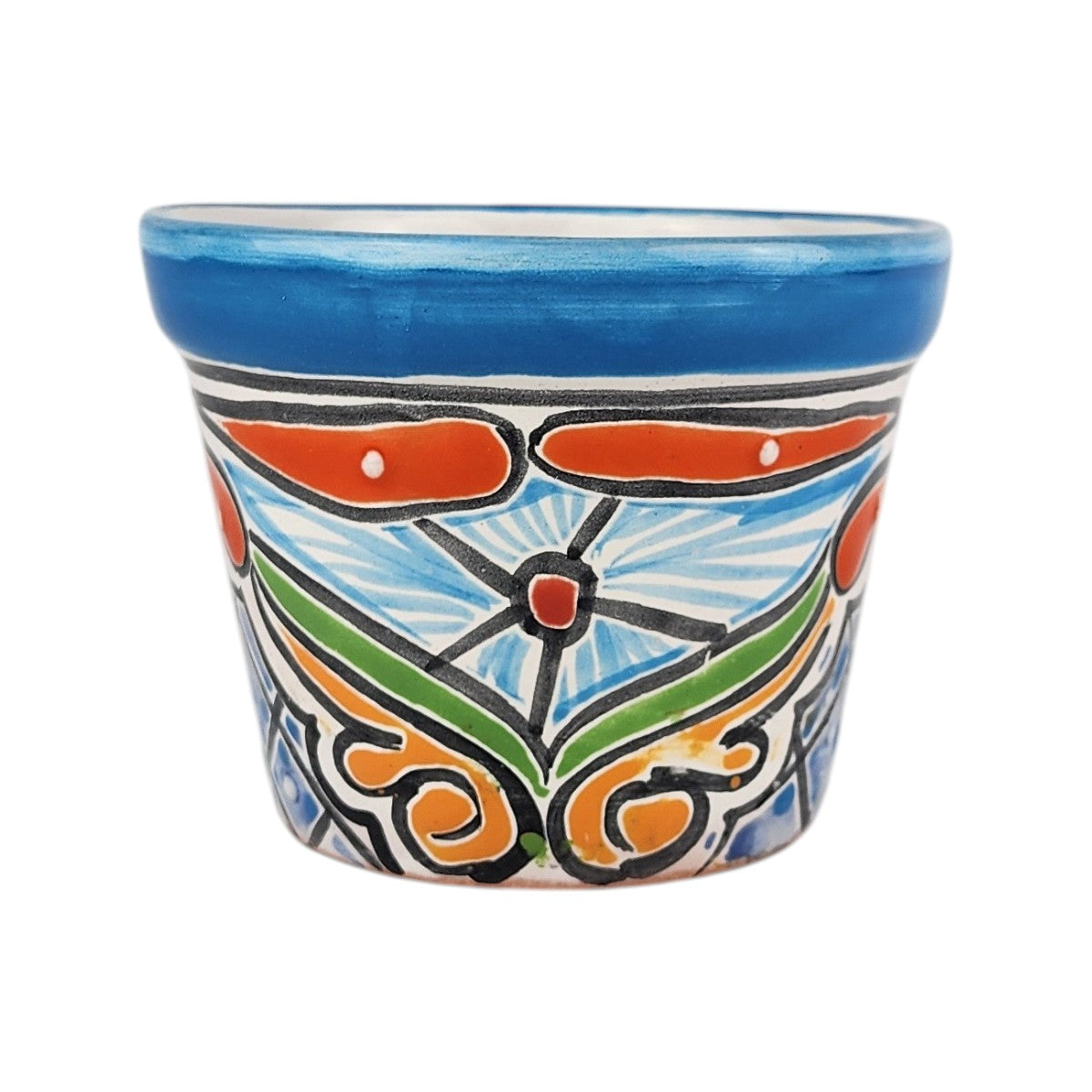 A small hand-painted ceramic planter pot with a vibrant blue rim and a colorful hand-painted floral and scroll pattern in orange, green, white, and black on a white background.