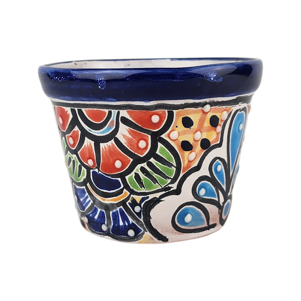 A small hand-painted ceramic planter pot with a vibrant Mexican Talavera style design, featuring a deep blue glazed rim and multicolored floral and geometric patterns on a white base, isolated on a white background.