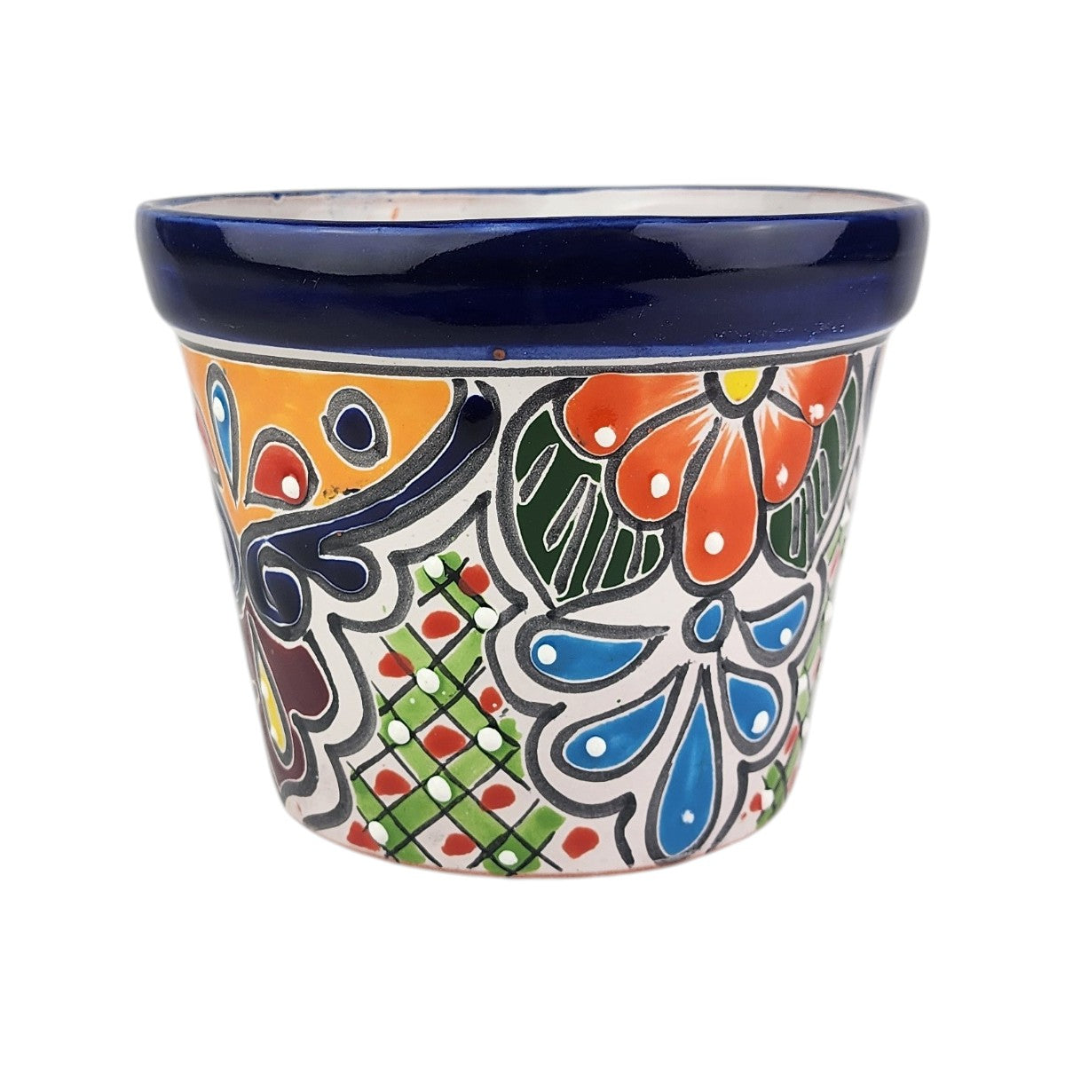 A hand-painted ceramic planter pot with a white base, featuring a vibrant Mexican Talavera style design with blue, orange, green, and red floral and geometric patterns, and a glossy dark blue rim.