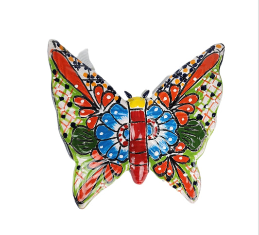 Decorative ceramic wall hanging with colorful floral design on a white background