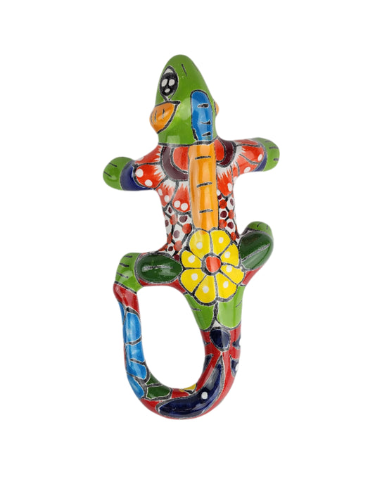 Colorful ceramic lizard-shaped bottle opener on a white background
