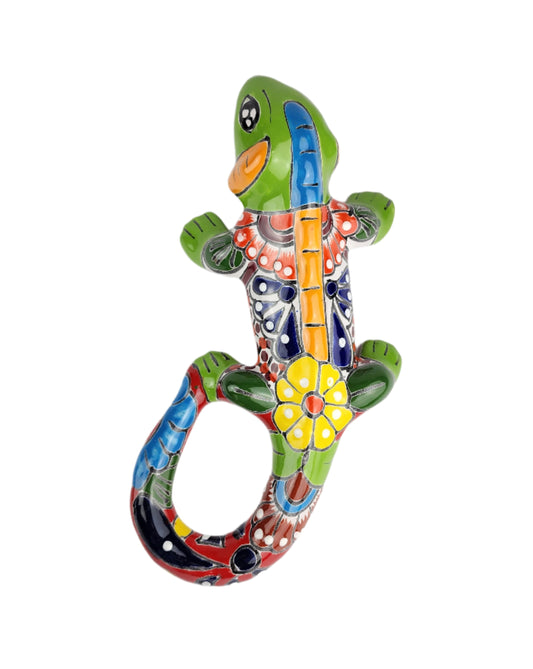 Colorful ceramic lizard wall art on a white background