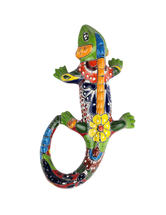 Colorful ceramic lizard wall art on a white background