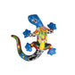 Colorful ceramic lizard wall art on a white background