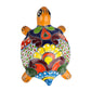 Colorful turtle-shaped ceramic figurine on a white background