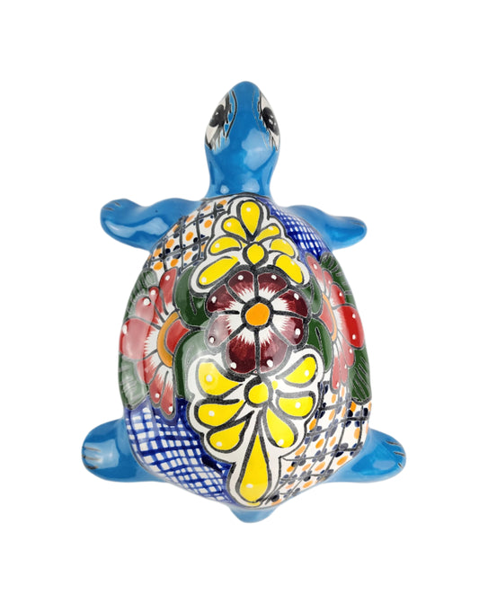 Colorful turtle with floral design on a white background