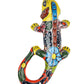 Colorful ceramic lizard sculpture on a white background
