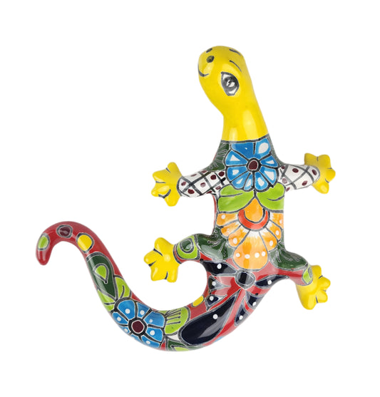 Colorful ceramic lizard wall art on a white background