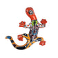 Colorful ceramic lizard sculpture on a white background