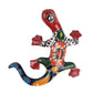 Colorful ceramic lizard wall art on a white background