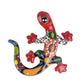 Colorful ceramic lizard wall art on a white background
