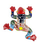 Colorful ceramic frog wall art on a white background