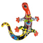 Colorful ceramic lizard wall art on a white background