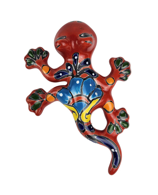 Colorful ceramic lizard wall hanging on a white background