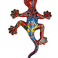 Colorful ceramic lizard on a white background