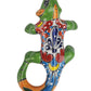 Colorful ceramic lizard figurine on a white background