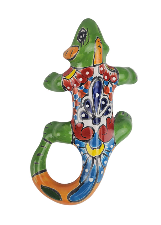 Colorful ceramic lizard figurine on a white background