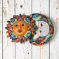 Talavera-style Sun and Moon ceramic wall décor set with colorful floral patterns on rustic white wood background