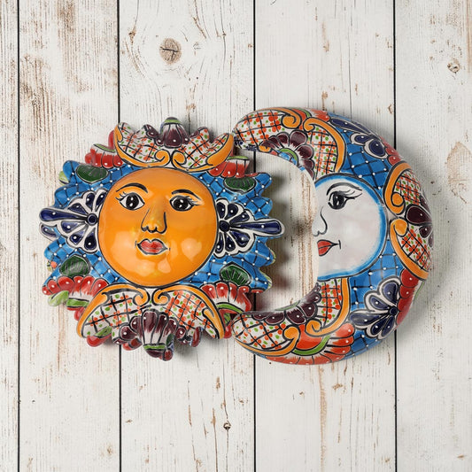 Blue Talavera-style Sun and Moon ceramic wall décor set with orange and cream accents on rustic white wood background