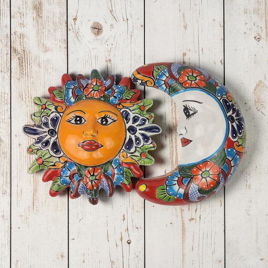 Red Talavera-style Sun and Moon ceramic wall décor set with blue, green, and orange floral patterns on rustic white wood background