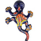 Decorative ceramic lizard with colorful patterns on a white background