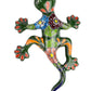 Colorful ceramic lizard wall art on a white background