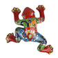 Colorful ceramic frog wall art on a white background