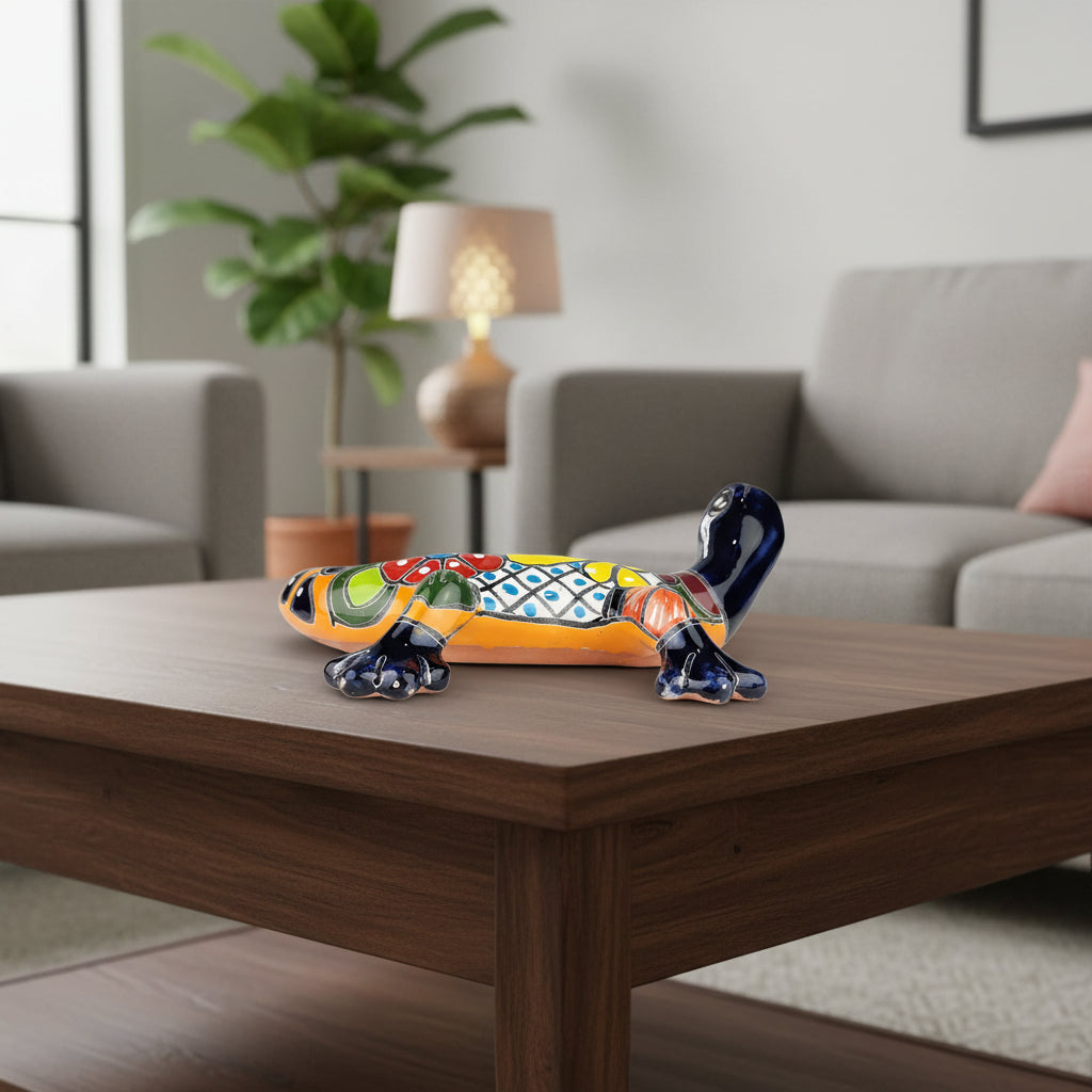 Colorful ceramic gecko on a coffee table