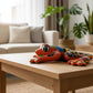 Colorful ceramic frog on a coffee table