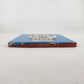 Side view of 4 1/8 inch floral sugar skull ceramic tile showing thickness and unfinished clay edge