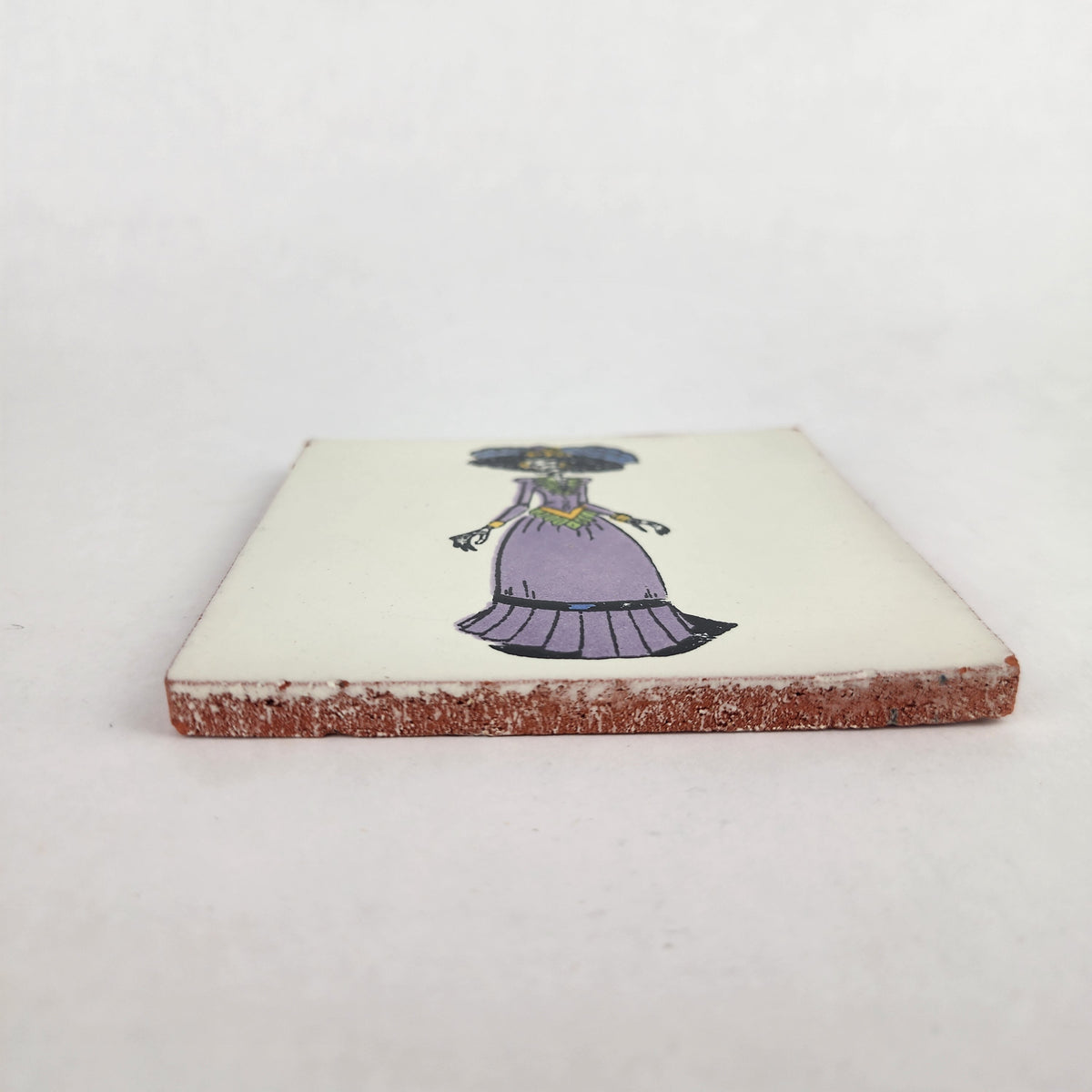 White Catrina ceramic tile shown from front edge highlighting ceramic thickness and glazed surface